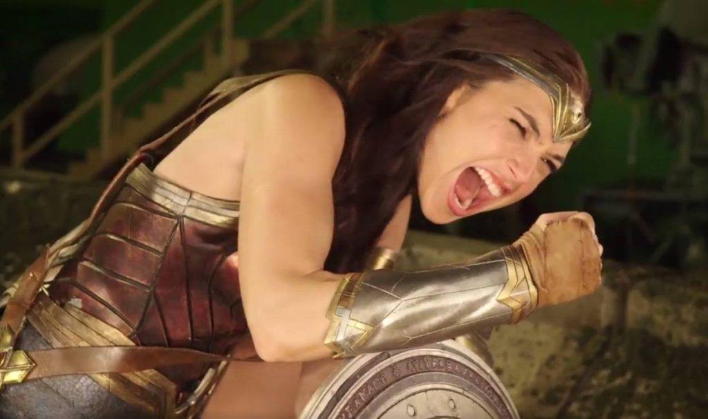 Wonder Woman (Gal Gadot) flexes her arm in a scene from the movie