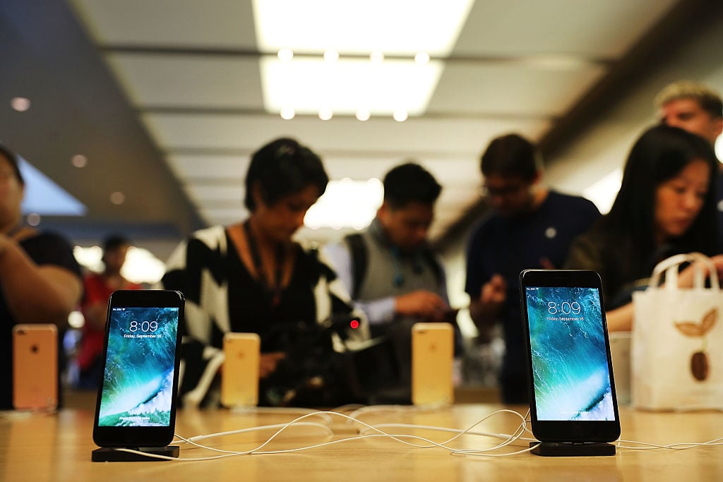 The new iPhone 7 and the 7 Plus are displayed on a table at an Apple store