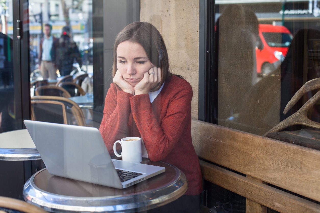 bored woman in front of computer