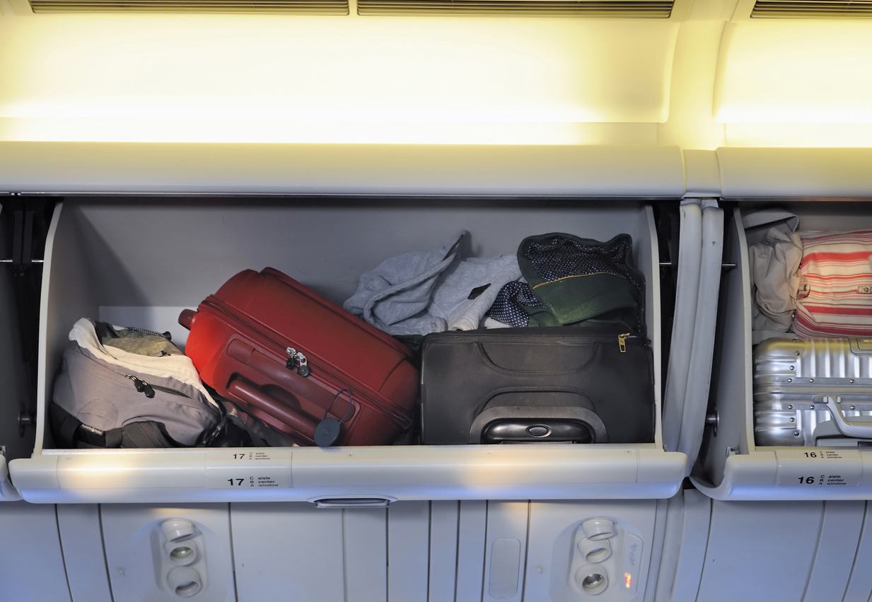 Carry-on luggage in overhead storage compartment