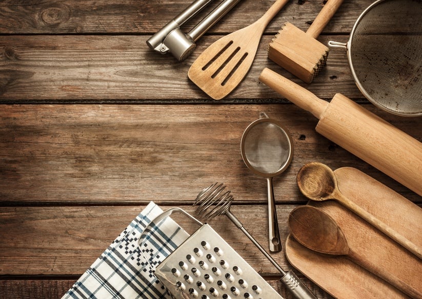 kitchen utensils on vintage planked wood