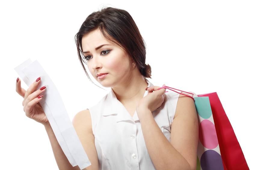 Brunette woman looking at her receipt