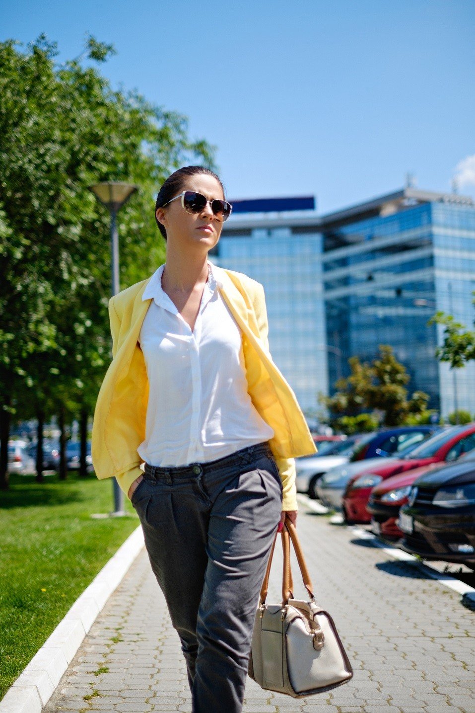 Woman walking in a hurry on the sidewalk