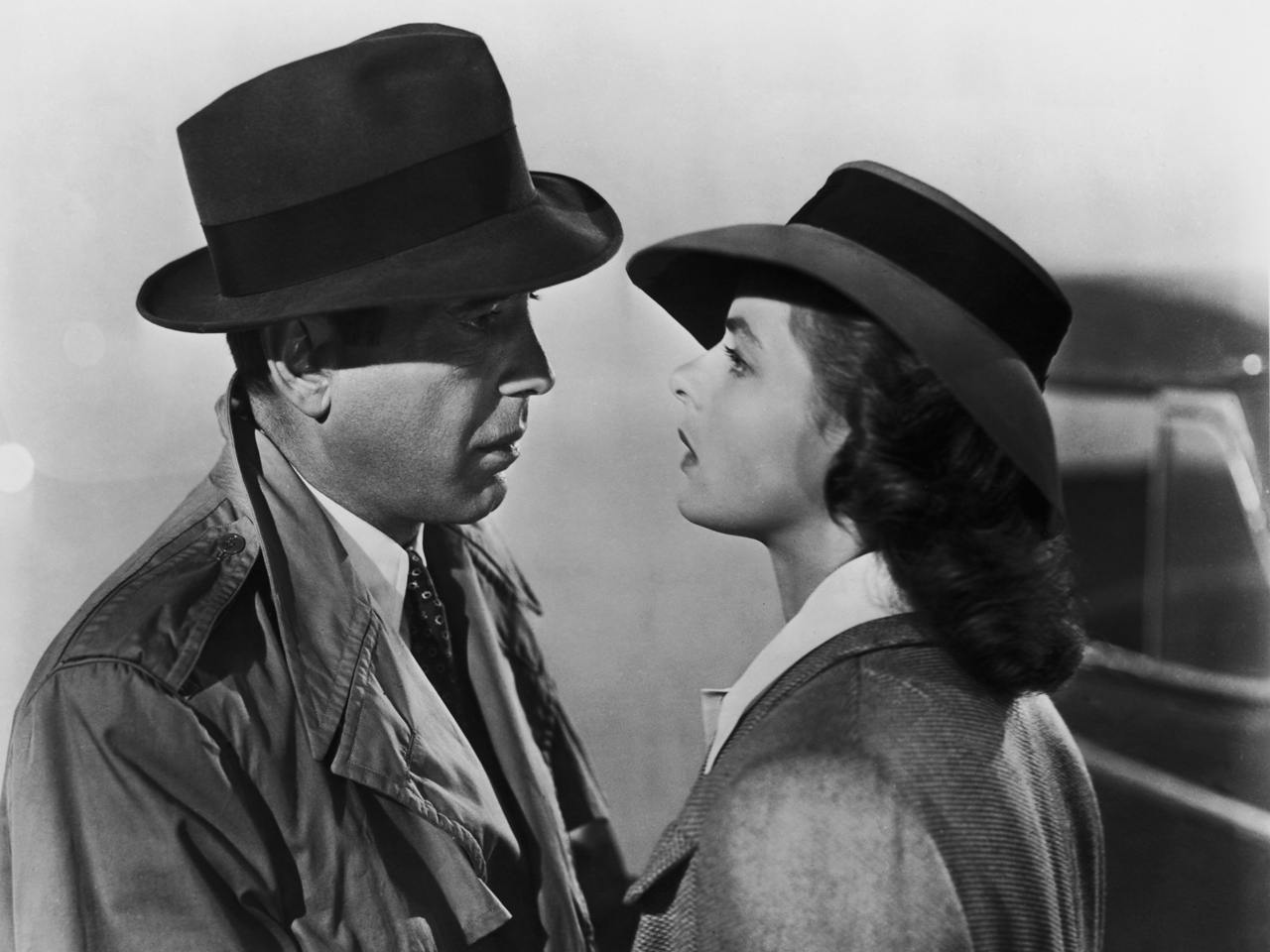 Humphrey Bogart and Ingrid Bergman talking in Casablanca.