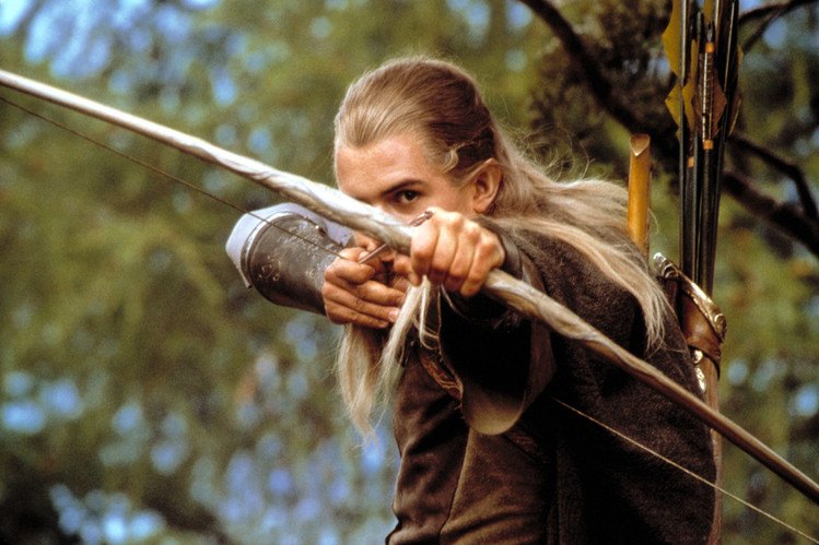 Legolas (Orlando Bloom) aims with his bow and arrow in 'The Lord of the Rings'