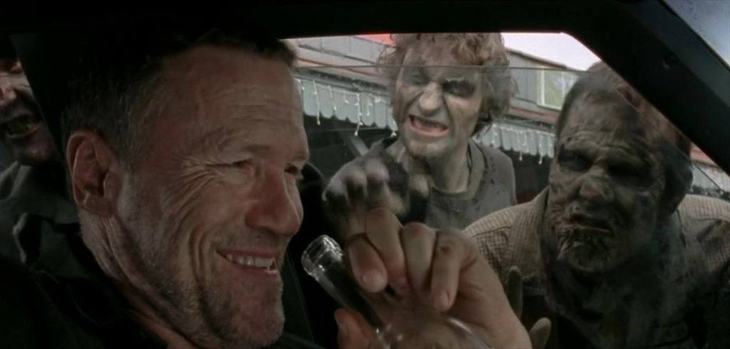 Merle drinking in a car as zombies descend on him in 'The Walking Dead' episode 'This Sorrowful Life'
