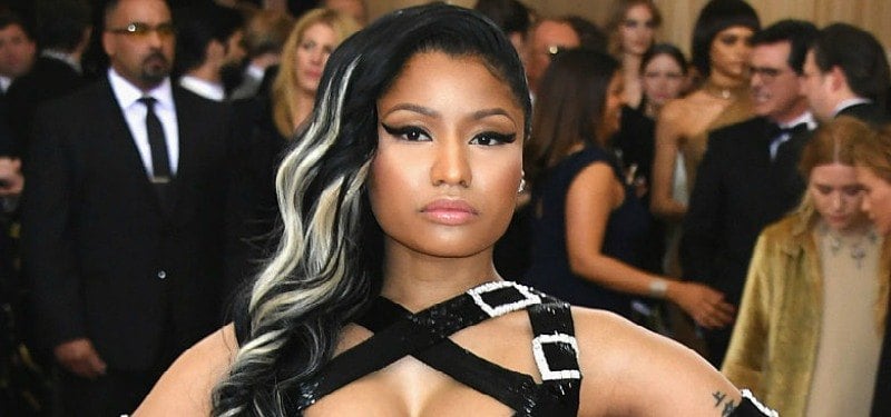 Nicki Minaj on the red carpet looking at the camera