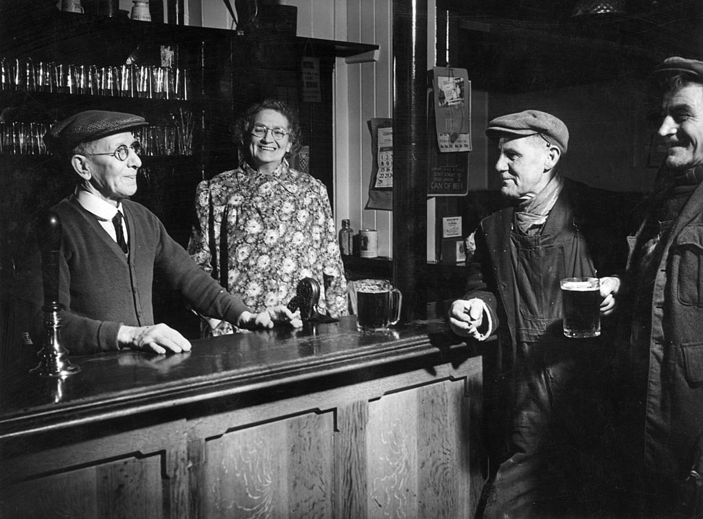 The regulars and bar staff at a public house in Windlesham, Surrey
