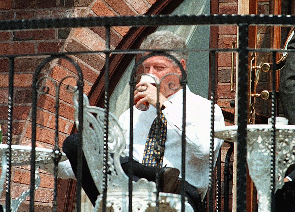President Bill Clinton enjoys a pint of beer during his walkabout at the Malthouse