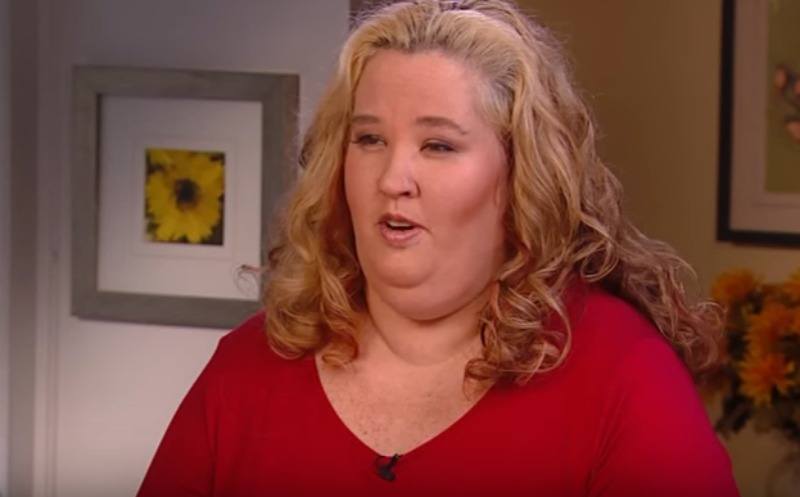 Mama June wearing a red shirt in an interview with ET