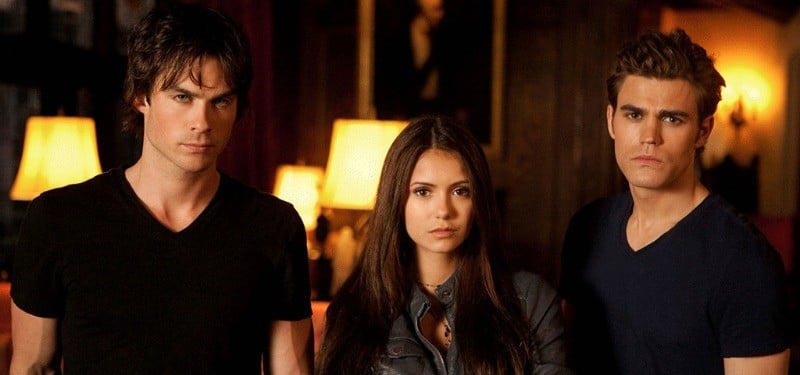 Ian Somerhalder, Nina Dobrev, and Paul Wesley stand next to each other in The Vampire Diaries