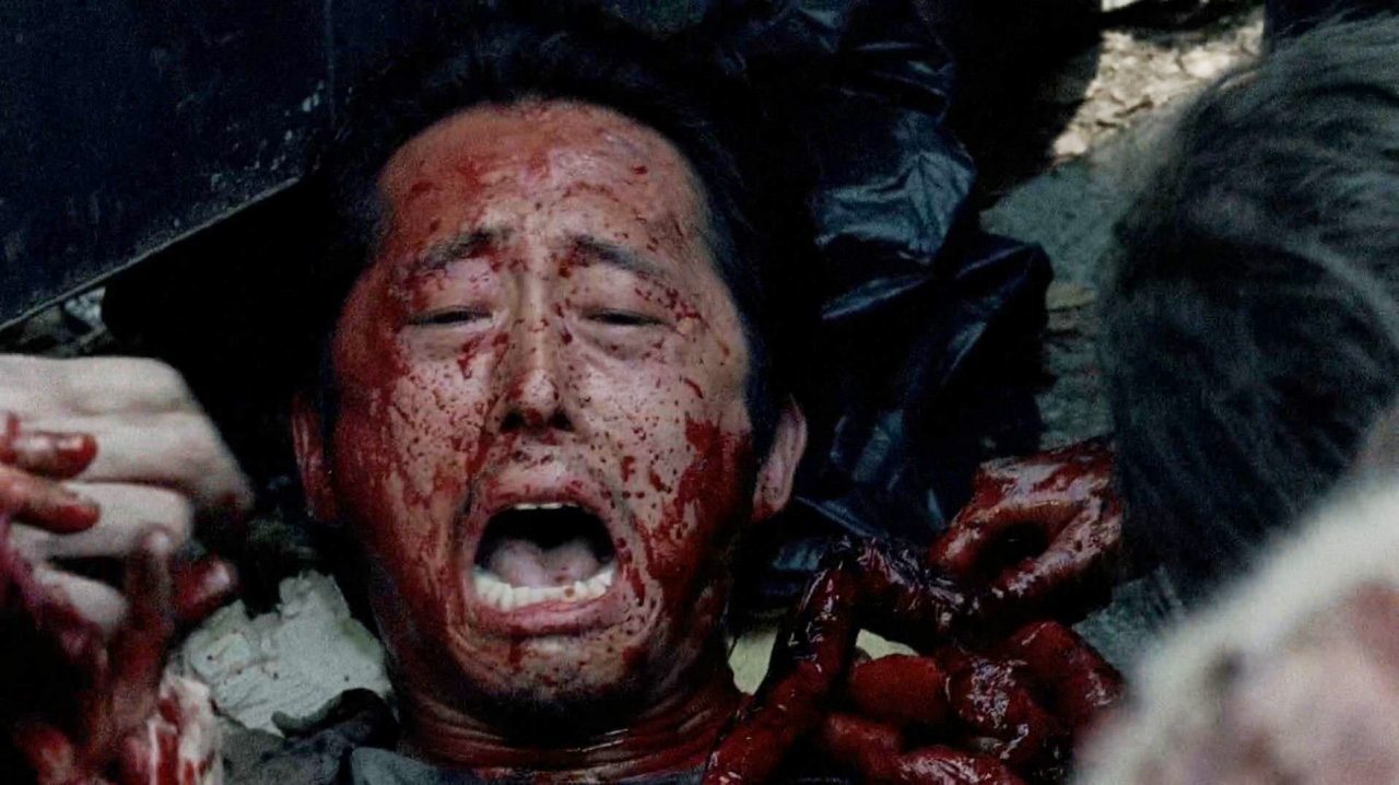 Glenn looks like he's getting eaten by walkers in a scene from Season 6 of 'The Walking Dead'