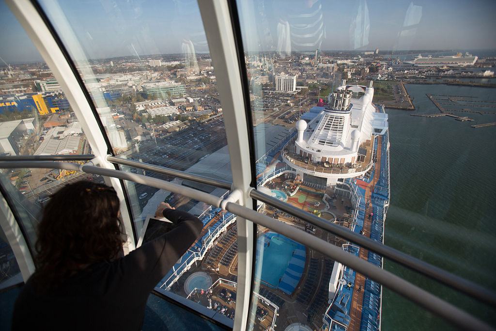 A visitor takes a photograph from the North Star observation capsule onboard the cruise ship Quantum of the Seas