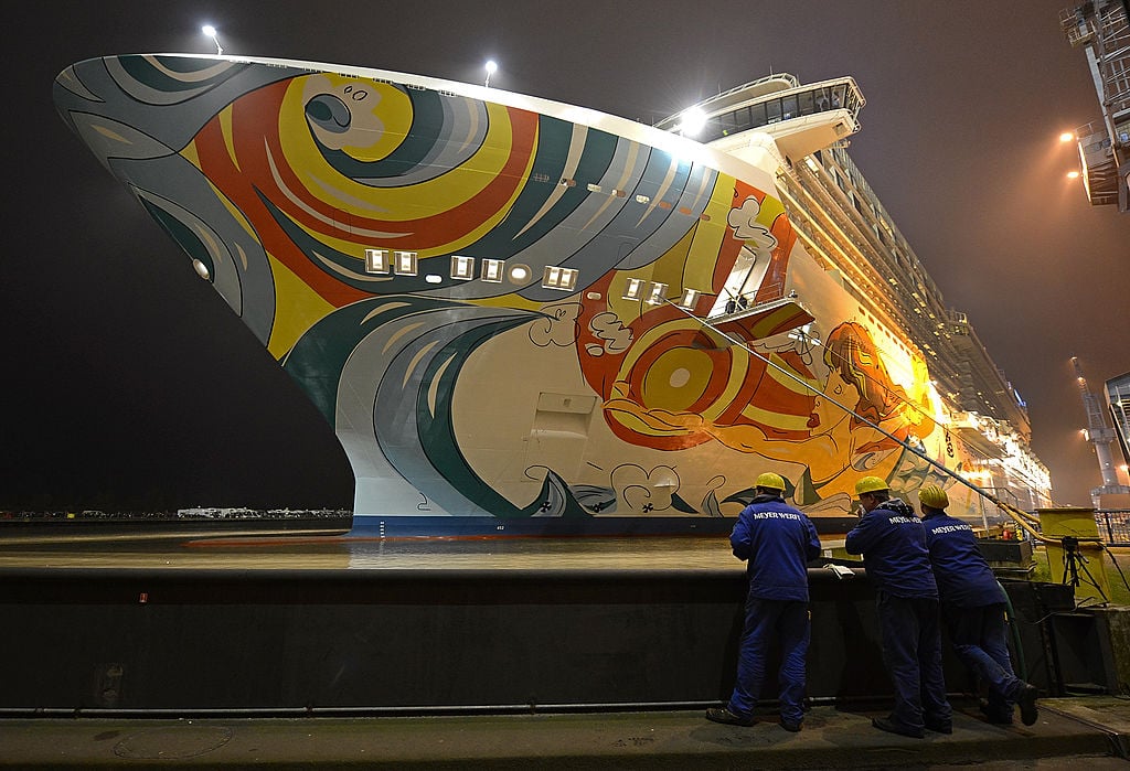 Employees of the Meyer Werft shipyard watch the Norwegian Getaway cruise