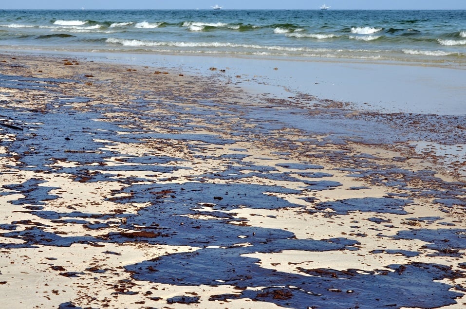 Oil washes up onto a beach