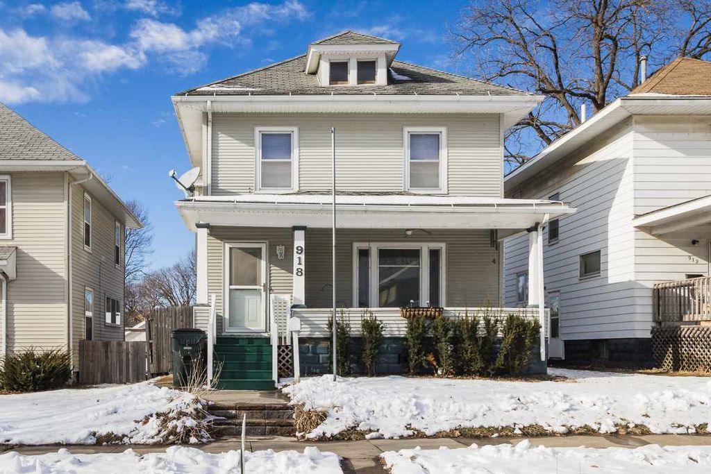 house with snowy yard