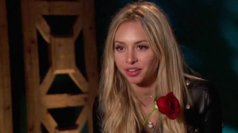 Corinne Olympios holding a rose