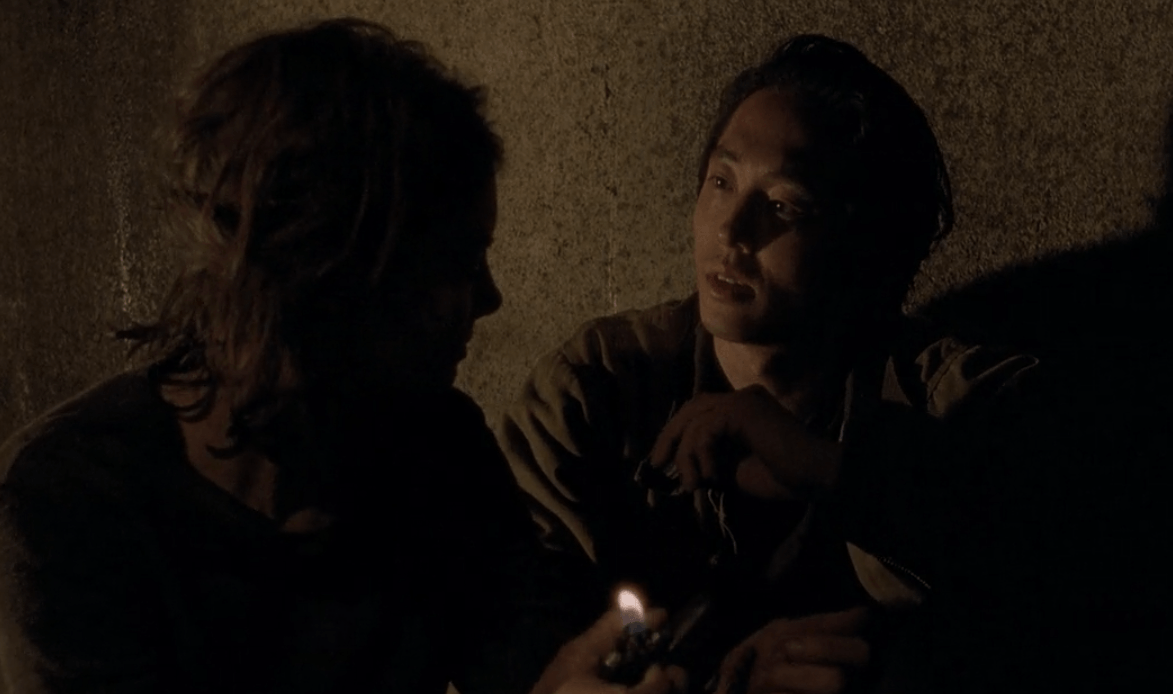 Maggie flicks a lighter on while talking to Glenn in a scene from 'The Walking Dead' episode, "Us"