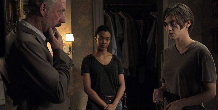 Maggie stares Gregory down while Sasha watches in a scene from 'The Walking Dead' episode "Go Getters"