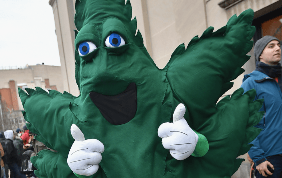 A cannabis mascot gives a thumbs up
