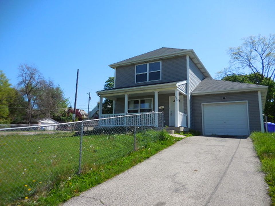 house with yard and driveway