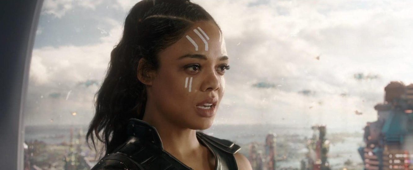 Tessa Thompson as Valkyrie in Thor: Ragnarok lookign shocked with the city in the distance