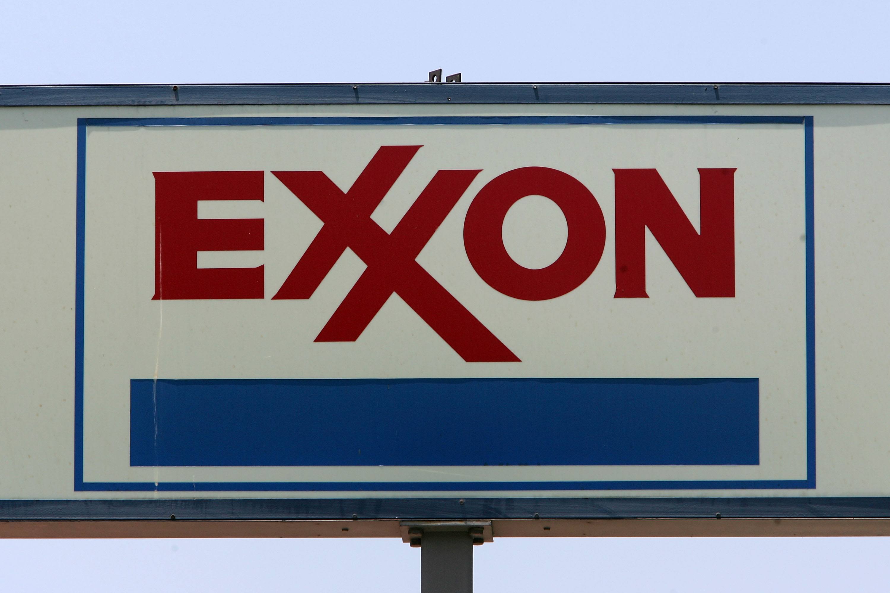 A sign advertises an Exxon gas station