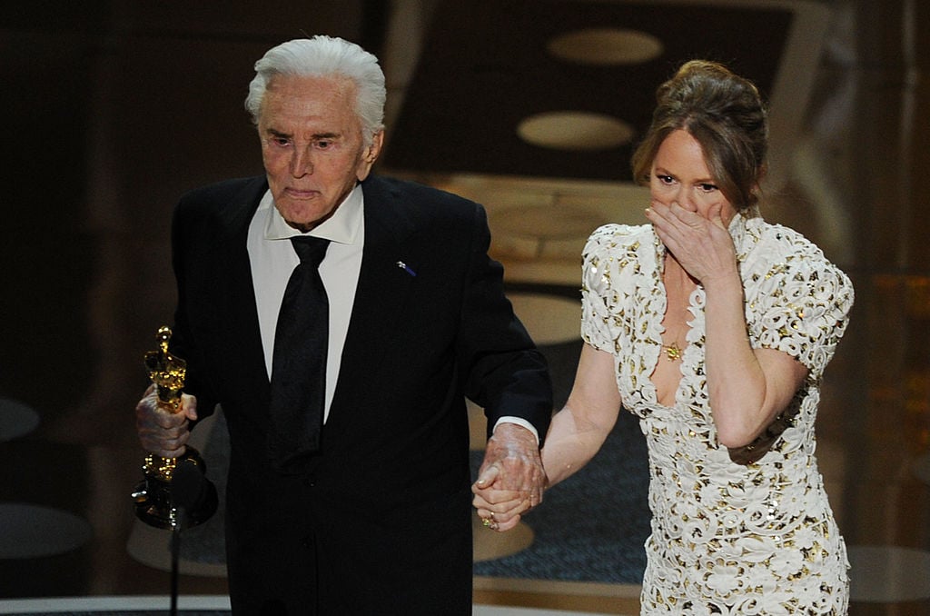 Presenter Kirk Douglas shakes hands with actress Melissa Leo after Leo won the Actress in a Supporting Role award for "The Fighter' onstage during the 83rd Annual Academy Awards