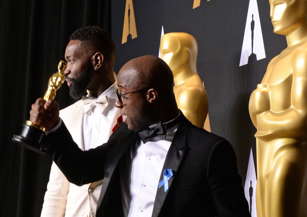 "Moonlight" director Barry Jenkins (R) and writer Tarell Alvin McCraney pose with the Oscar