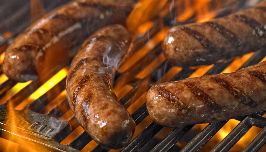 shot of meat on a grill at Noodle Village