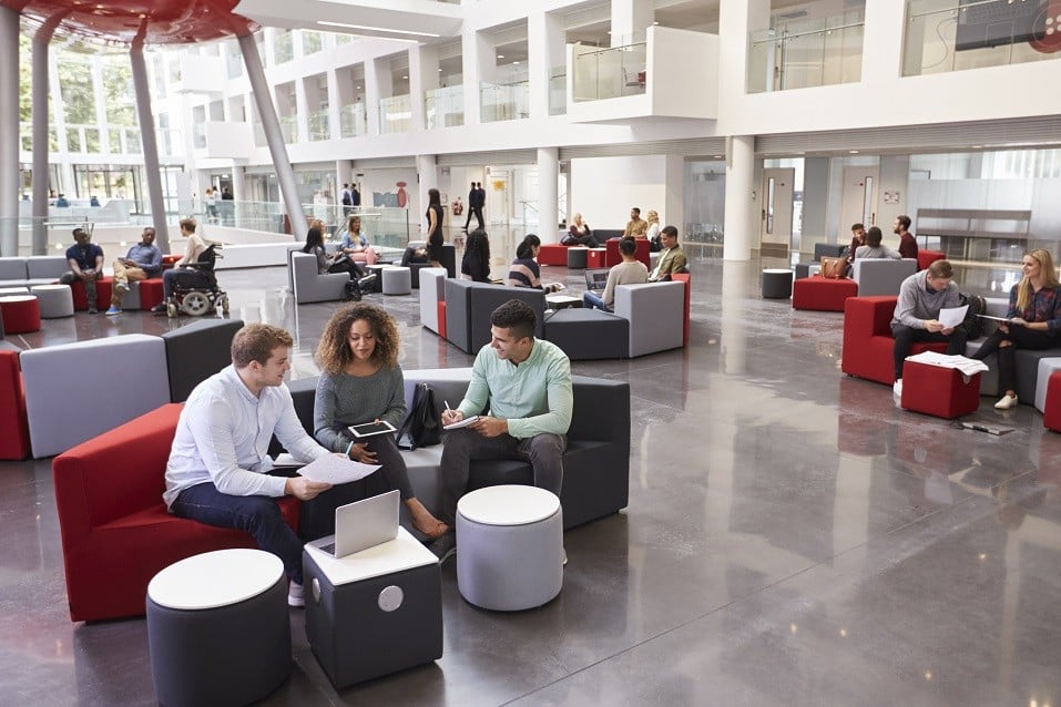 Students sitting in university atrium