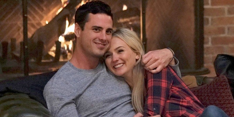 Ben and Lauren are snuggling on a couch in front of a fire The Bachelor.