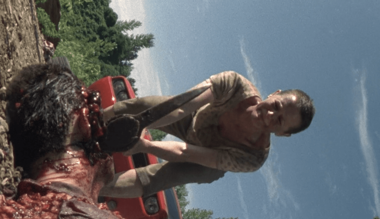 Carol putting an axe through Ed's head in 'The Walking Dead' episode 'Wildfire'