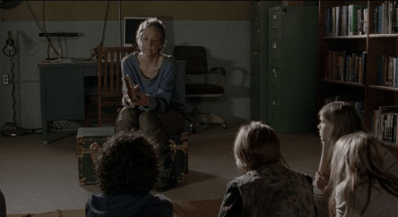 Carol sitting in front of the prison kids in 'The Walking Dead' episode '30 Days Without an Accident'