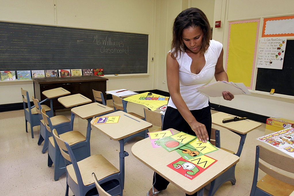 A teacher prepares her classroom