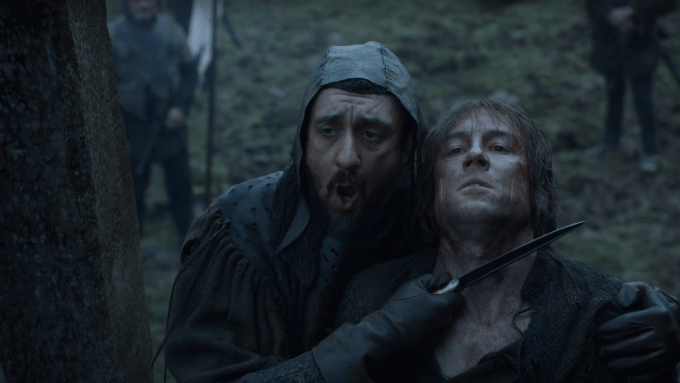 Edmure Tully struggles while a man holds a knife to his throat 