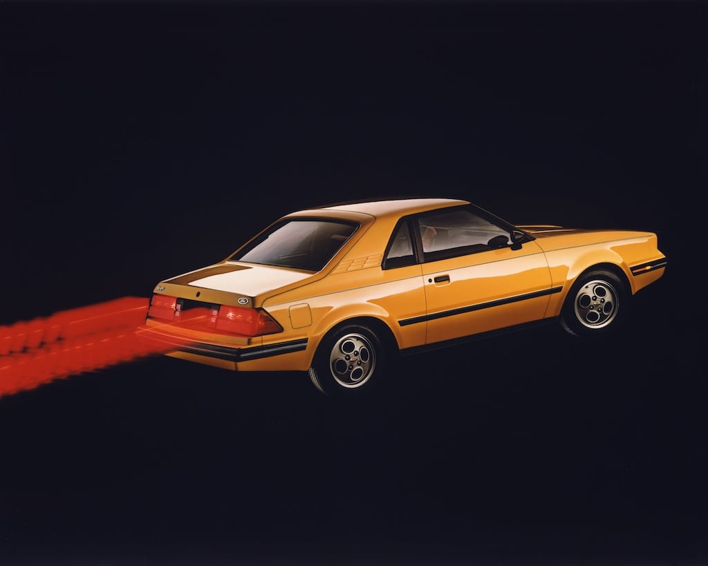 A vintage advertisement for the 1982 Ford EXP