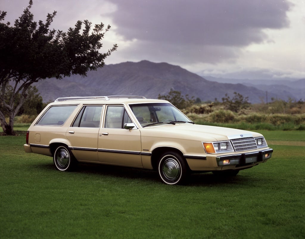 A 1983 Ford LTD Station wagon parked on grass.