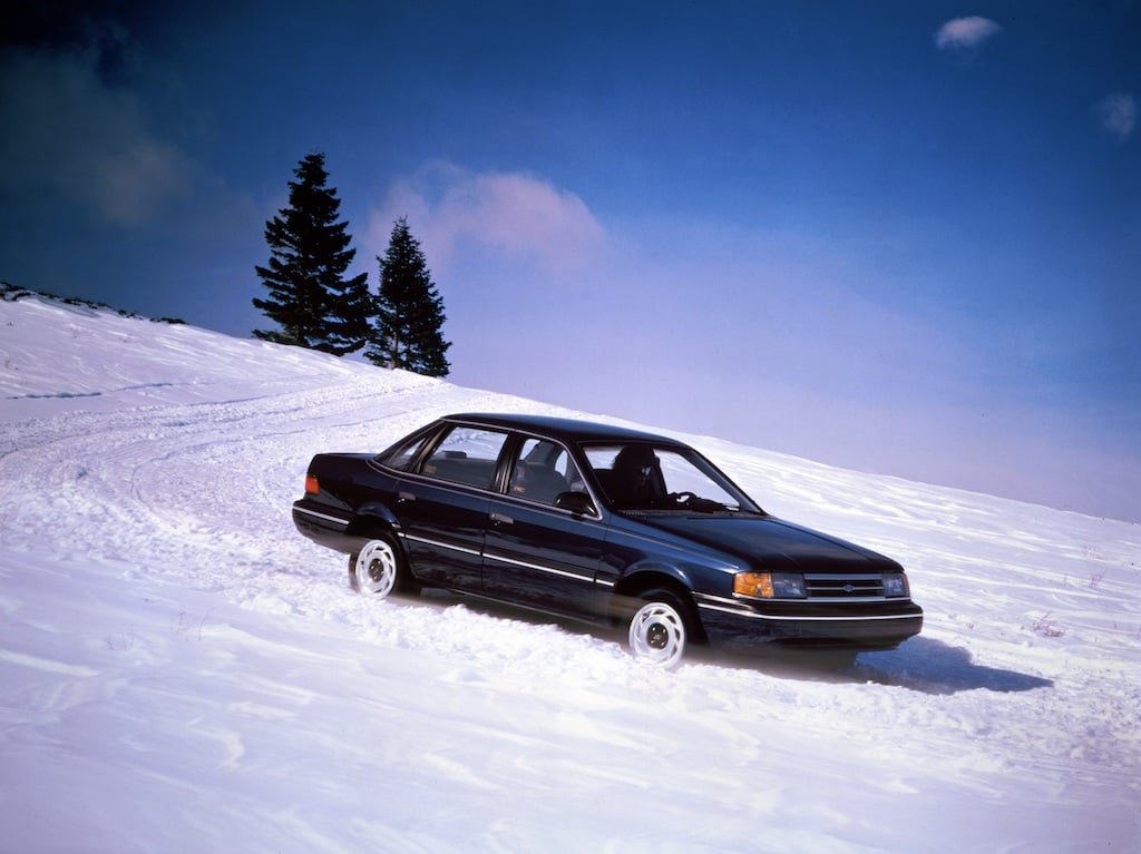 A 1989 Ford Tempo AWD being driven through snow.