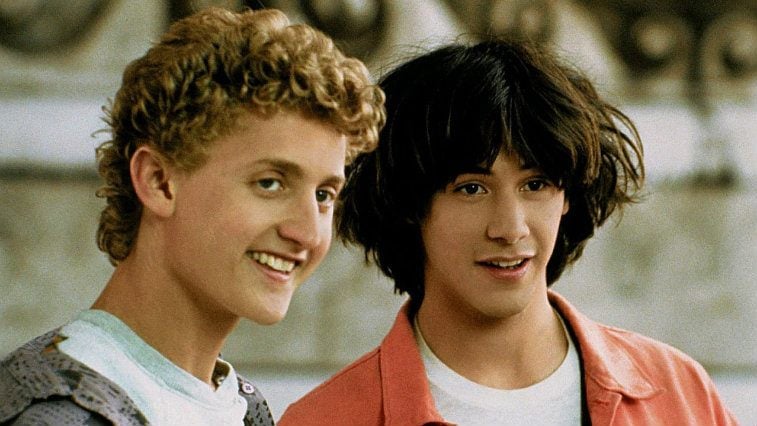 Alex Winter and Keanu Reeves smiling together in Bill and Ted's Excellent Adventure