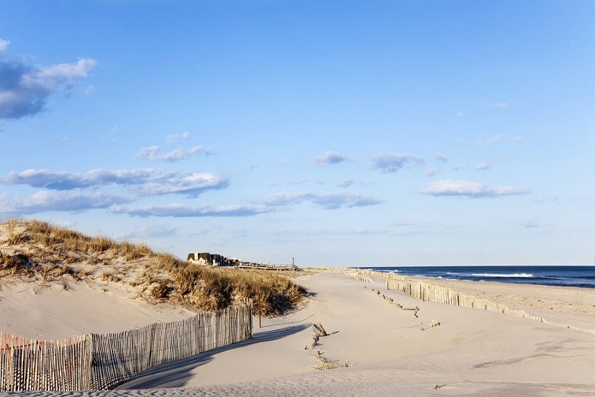 Beach fence, sand houses and the ocean