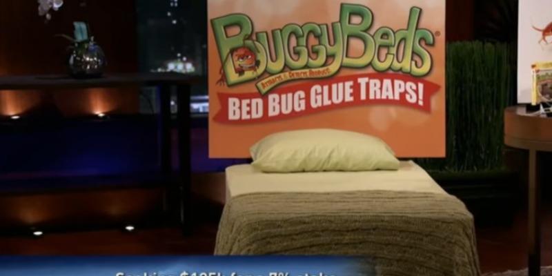A bed display with a sign reading "BuddyBeds" on Shark Tank.