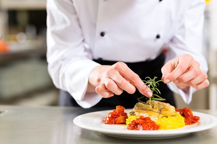 Chef in restaurant kitchen cooking