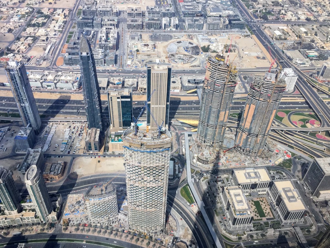 cranes on top of skyscrapers