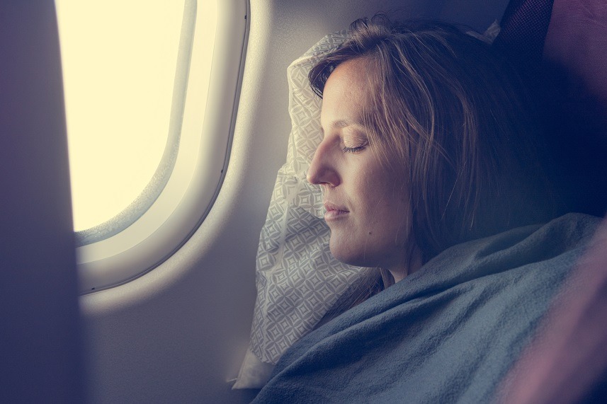 passenger sleeping covered with blanket