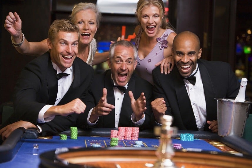 Five people in casino playing