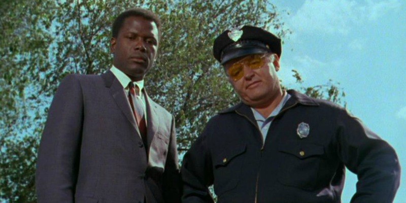 Virgil Tibbs and Gillespie in looking down at the camera In The Heat of the Night. 