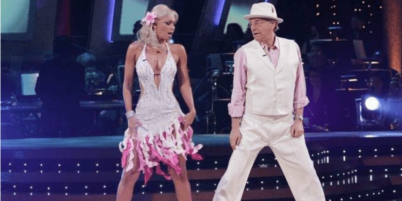 Jerry Springer and Kym Johnson dancing on Dancing With the Stars.