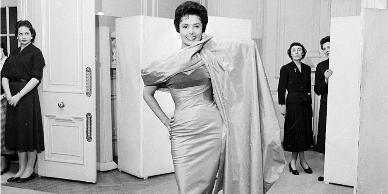 Lena Horne tries on a dress.