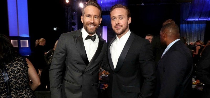 Ryan Reynolds and Ryan Gosling pose for a picture together in suits.